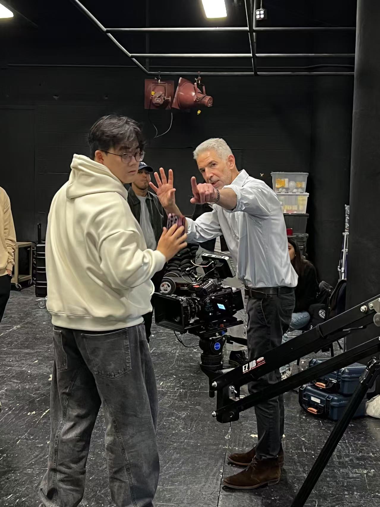 Qijing Wang working with Tim Palmer on set